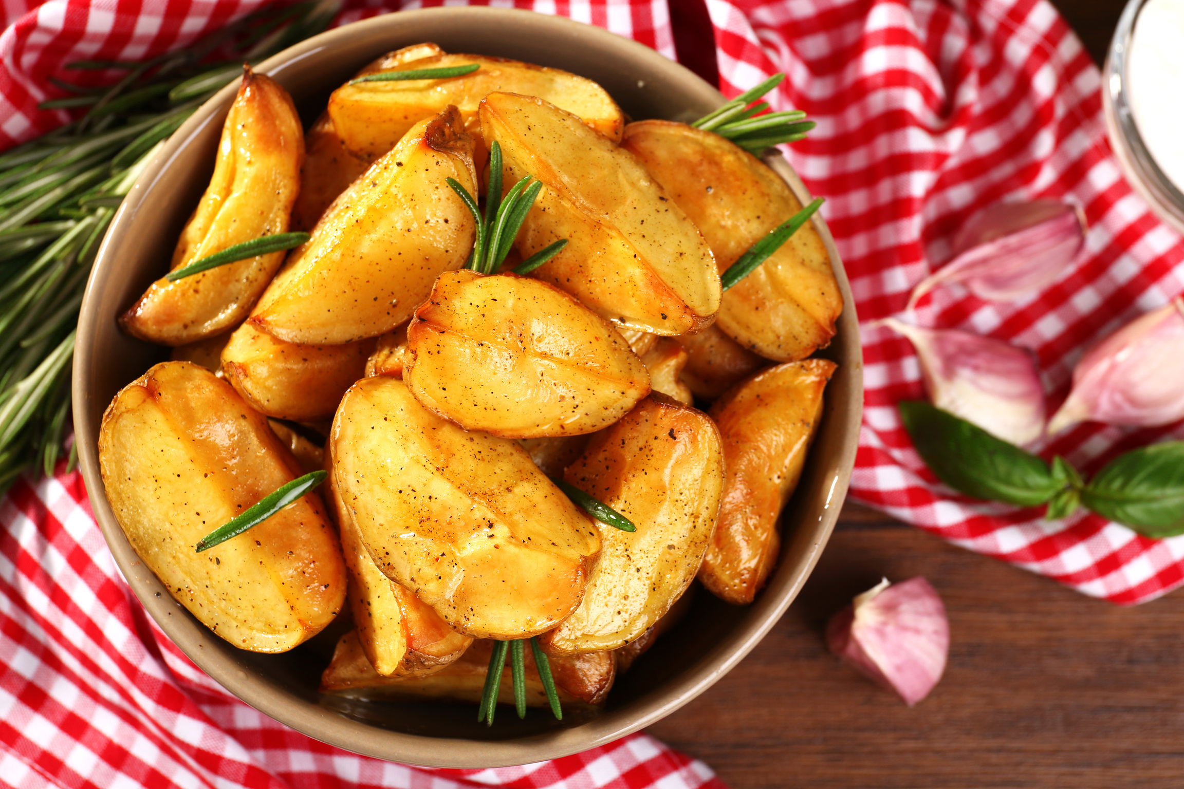 Baked Potato Wedges in Bowl with Napkin Top View